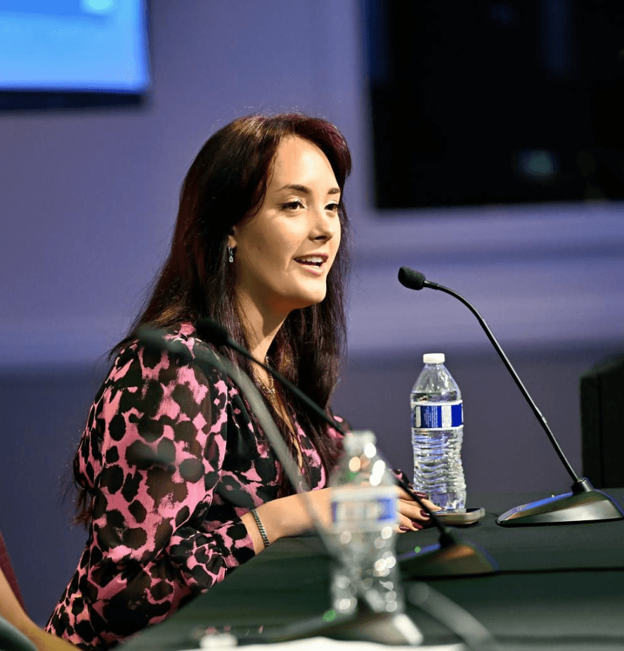 Bella speaking on a panel